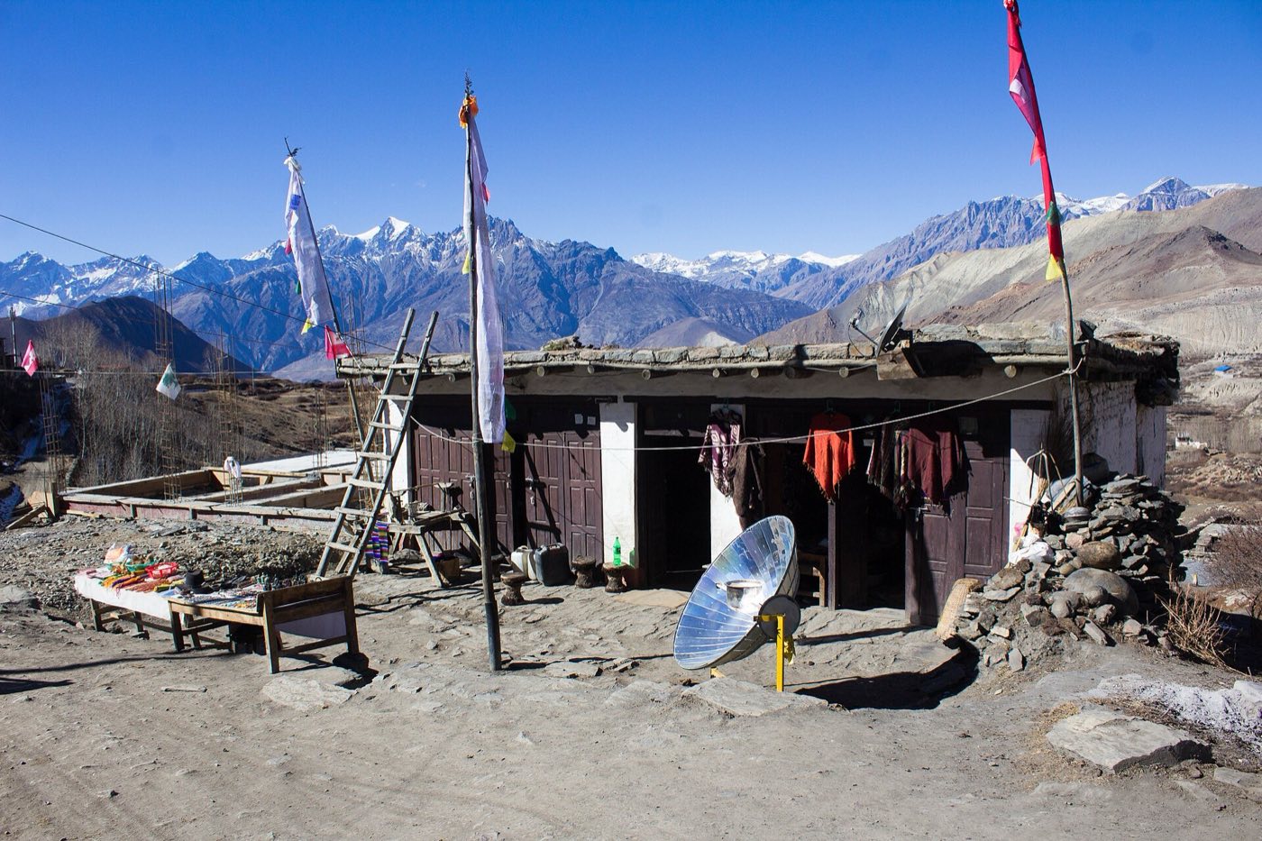 A solar cooker outside a home in Ranipauwa, Mustang. Photo: Bijay Chaurasia, CC BY-SA 4.0